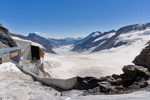 Experience the stunning Aletsch Glacier, nestled in the Swiss Alps, with clear blue skies and majestic mountains. jigsaw puzzle