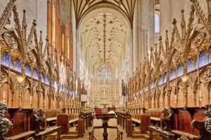Explore the intricate Gothic architecture inside Winchester Cathedral showcasing stunning arches and carvings. jigsaw puzzle