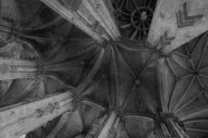 Black and white photo of a gothic vaulted ceiling with intricate stone columns. jigsaw puzzle