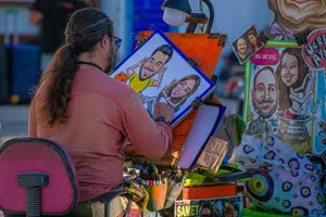 Talented street artist creating vibrant caricatures outdoors. Captivating and lively artistic scene. jigsaw puzzle