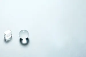 Minimalist composition with a transparent crystal sphere and cube casting shadows on a light background. jigsaw puzzle