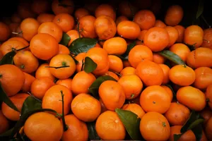 A vivid close-up of fresh, juicy oranges showcasing their vibrant color and freshness. jigsaw puzzle