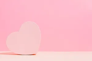 Simple heart-shaped decoration with a pastel pink background, perfect for romantic themes. jigsaw puzzle