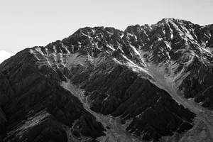 A black and white photo of a mountain range jigsaw puzzle