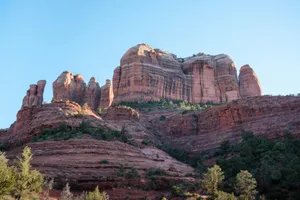 A large rock formation in the middle of a forest jigsaw puzzle