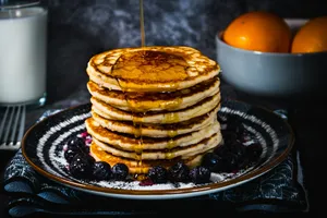 pancakes with egg on black ceramic plate jigsaw puzzle