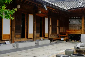 A traditional korean wooden house with a stone courtyard. jigsaw puzzle