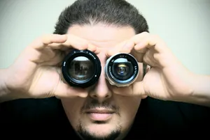 a man looking through a pair of binoculars jigsaw puzzle