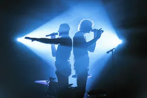 man and woman singing on stage jigsaw puzzle