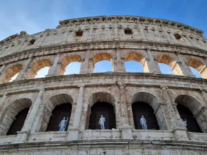 View of the ancient Colosseum in Rome with statues visible in the arches. jigsaw puzzle