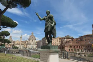 Statue of Julius Caesar overlooking the ancient Roman Forum under a bright blue sky in Rome, Italy. jigsaw puzzle