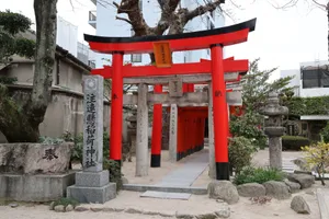 Serene pathway lined with iconic red torii gates in a traditional Japanese shrine. jigsaw puzzle