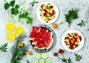 Bright and fresh fruit platters featuring watermelon, citrus, and greens, styled for a summer vibe. jigsaw puzzle