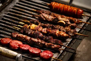 Delicious assortment of grilled meat skewers sizzling on the barbecue. Perfect for outdoor feasts. jigsaw puzzle