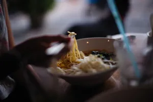 Close-up of a bowl of freshly served Asian noodle soup with chopsticks. jigsaw puzzle