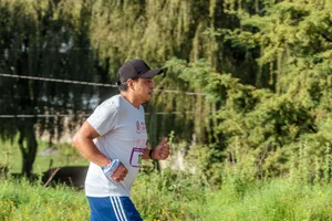 A man running through a park, showcasing fitness and exercise in nature. jigsaw puzzle