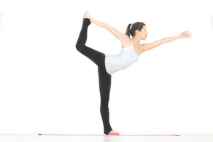 Young woman gracefully balancing in yoga pose indoors. jigsaw puzzle