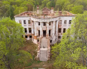 Aerial view of an old, abandoned palace surrounded by lush greenery in Penza Oblast, Russia. jigsaw puzzle