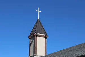 A serene church tower with a cross under a vibrant blue sky in Allen, Texas. jigsaw puzzle