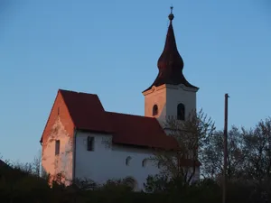 Charming European church silhouette against dusk sky, highlighting architectural details. jigsaw puzzle