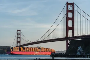 Large cargo ship passes under the iconic Golden Gate Bridge in San Francisco at daytime. jigsaw puzzle
