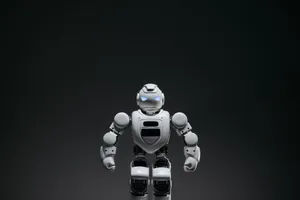 Close-up of a white toy robot with glowing eyes in a studio setting. jigsaw puzzle