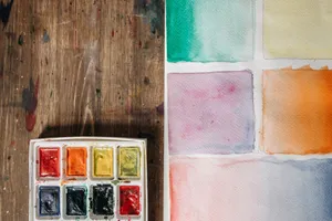 A watercolor palette with various color swatches on paper, ideal for artistic projects. jigsaw puzzle
