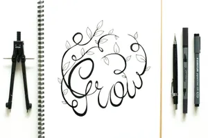 Artistic flat lay with drawing of leaves and 'Grow' text, surrounded by compass and sketching tools. jigsaw puzzle