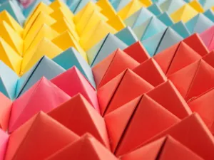 Vibrant folded paper pyramids in a colorful geometric pattern. jigsaw puzzle