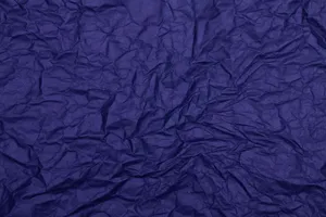 Detailed texture of dark blue wrinkled paper, ideal for backgrounds and design projects. jigsaw puzzle