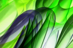 Abstract image with green and purple shapes resembling blurred leaves, creating a dynamic visual. jigsaw puzzle