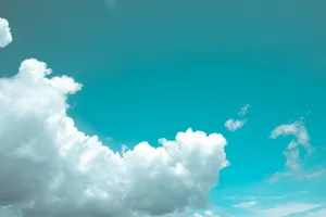 Bright and serene view of fluffy white clouds against a vibrant blue sky. jigsaw puzzle
