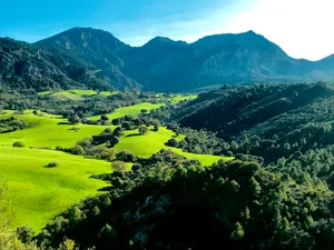 green grass field and mountains during daytime jigsaw puzzle