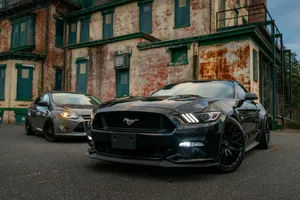black bmw coupe parked on street during daytime jigsaw puzzle