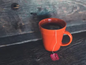 orange ceramic teacup on gray bord jigsaw puzzle