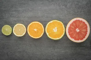 sliced orange fruit on black textile jigsaw puzzle