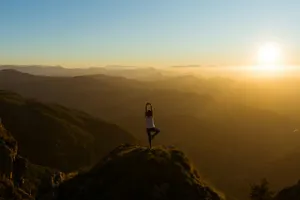 woman stretching on mountain top during sunrise jigsaw puzzle