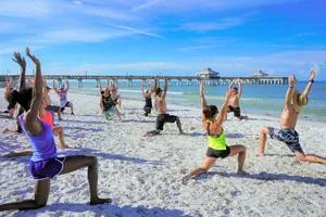 people exercising on seashore during daytime jigsaw puzzle