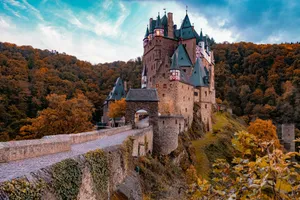 gray concrete castle on hill under blue sky during daytime jigsaw puzzle