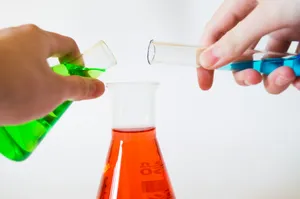 person holding laboratory flasks jigsaw puzzle