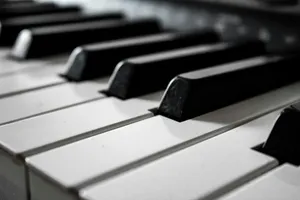 grayscale photography of piano jigsaw puzzle