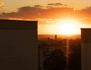 Captivating sunset over city skyline with vibrant orange hues during golden hour. jigsaw puzzle