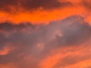 A gorgeous display of vivid orange and purple hues during a stunning sunset. jigsaw puzzle