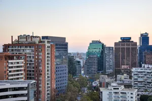 View of Santiago's skyline featuring modern architecture during sunset. jigsaw puzzle