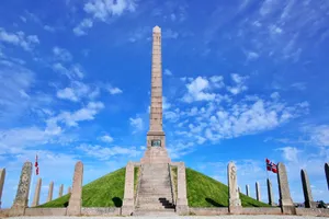 Stunning view of the Haraldshaugen monument under a clear blue sky in Haugesund, Norway. jigsaw puzzle