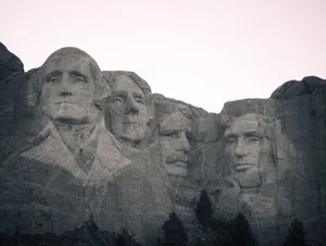 Iconic black and white view of Mount Rushmore, showcasing historical presidential carvings. jigsaw puzzle